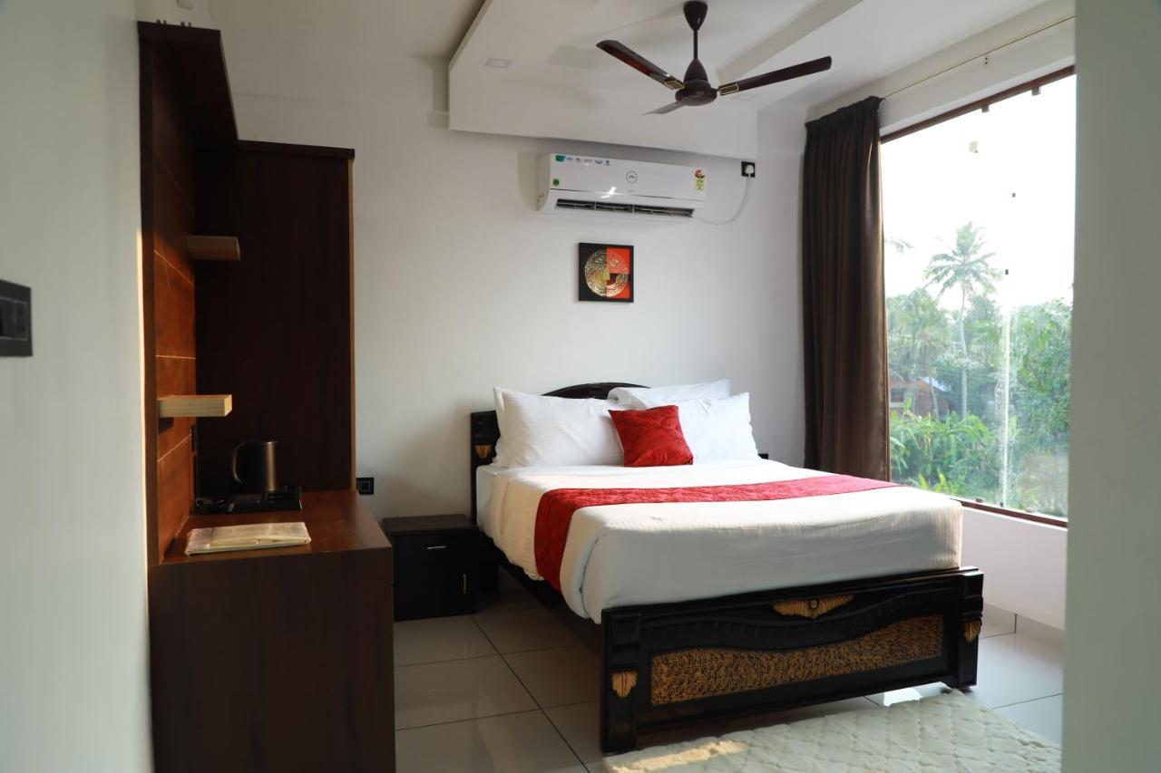 Achoos Residency Hotel Tiruvalla Buitenkant foto